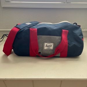 Blue and red small duffel